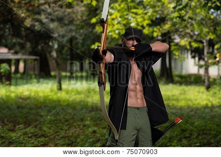 Caucasian Man Training With The Bow