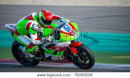 ASSEN, NETHERLANDS - OCTOBER 19, 2014: Competitor number 58 racing through the apex of the 1000cc superbike races on the TT Assen circuit