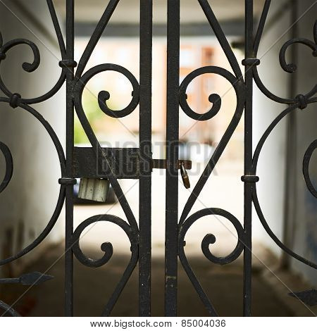 Gateway behind the wrought-iron gates fragment