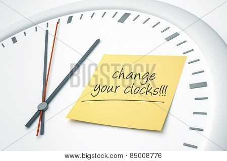 An image of a bright clock with a sticky note and the message change your clocks