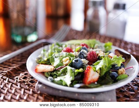 tasty berry salad with blue cheese crumbles and walnuts