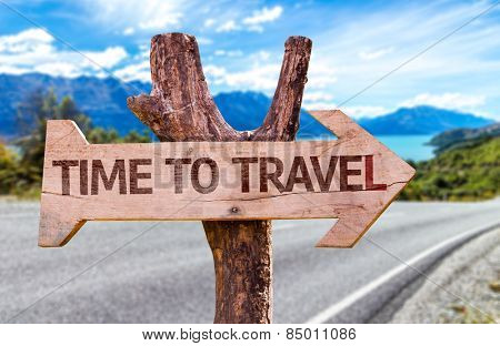 Time to Travel wooden sign with road background