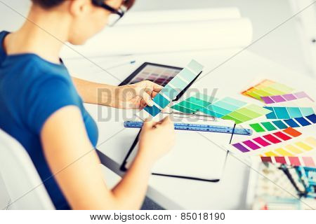 interior design and renovation concept - woman working with color samples for selection