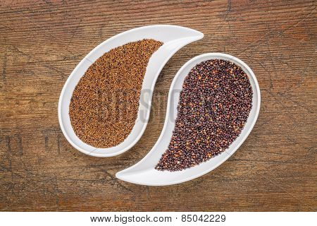 kaniwa and black quinoa  grain on on teardrop shaped bowls against rustic wood