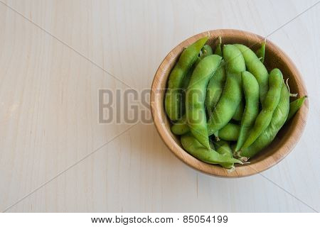 Japanese green soy bean on the wooden table.
