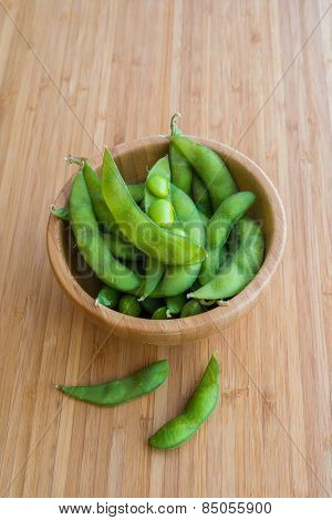 Japanese green soy bean on the wooden table.
