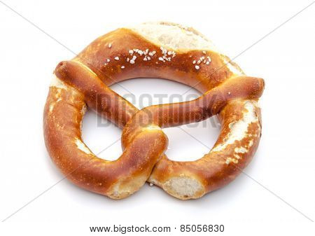 Freshly baked salted lye pretzel. All on white background.