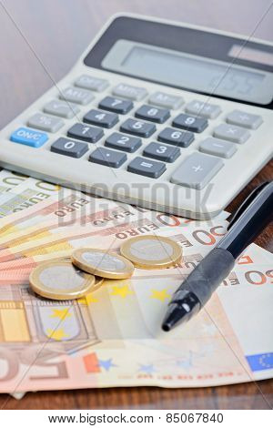 Calculator And Money On The Table