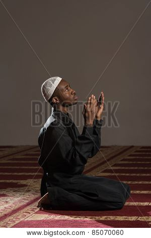 Young African Muslim Guy Praying