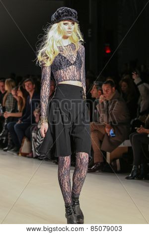 NEW YORK - FEBRUARY 13: A model walks the runway at the Mark & Estel Fall/Winter 2015 collection during Mercedes-Benz Fashion Week in New York on February 13, 2015.