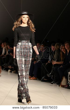 NEW YORK - FEBRUARY 13: A model walks the runway at the Mark & Estel Fall/Winter 2015 collection during Mercedes-Benz Fashion Week in New York on February 13, 2015.