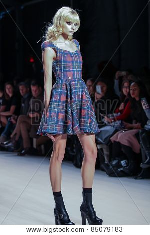 NEW YORK - FEBRUARY 13: A model walks the runway at the Mark & Estel Fall/Winter 2015 collection during Mercedes-Benz Fashion Week in New York on February 13, 2015.