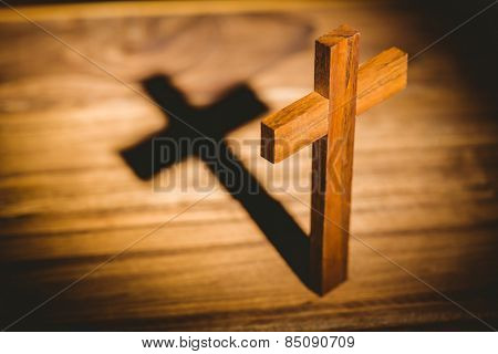 Overhead of crucifix icon on wooden table