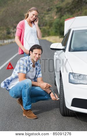Couple after a car breakdown at the side of the road
