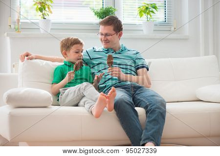 Happy Father And Little Boy Eating Ice-cream