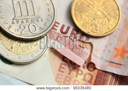 Torn Euro Note And Vintage Greek Coins