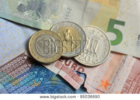 Torn Euro Note And Vintage Greek Coins
