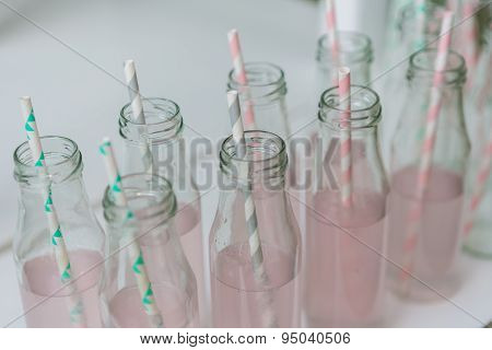 bottles with fresh pink lemonade