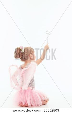 Little girl siting on the floor backwards