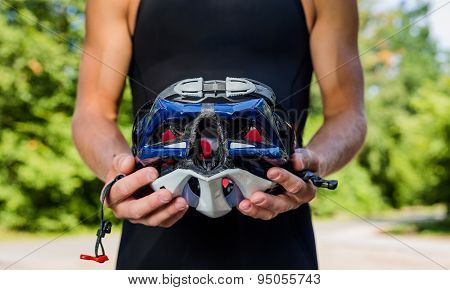 Professional cyclists wear a helmet for his safety