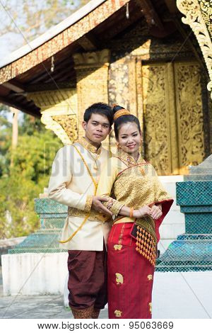 young boy and young girl in Laos national costume
