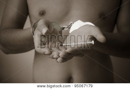 Syringe And Drug In Hand
