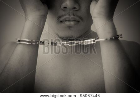 Young Man In Handcuffs