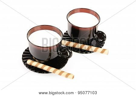 Two Cups With Milk And Cookies. Isolated Over White