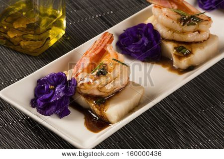 Grilled Shrimp With Raw Nail Fish On White Plate At Table