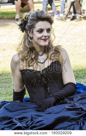 CAGLIARI, ITALY - May 29, 2016: Sunday at La Grande Jatte VIII Ed. At the Public Gardens - Sardinia - portrait of a beautiful woman in Victorian costumes