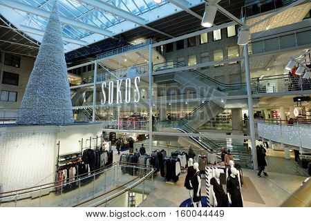 HELSINKI, FINLAND - NOVEMBER 26, 2016: People in the central department store Sokos decorated for Christmas. Sokos is a chain of department stores in Finland that is part of the S Group