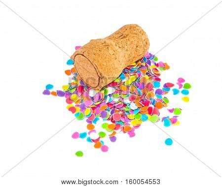 Champagne cork lying on the small heap of confetti isolated over white. Holidays and events concept.
