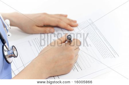 Female Doctor and Paper Work