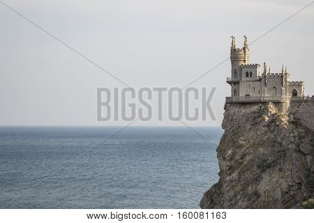 The decorative Neo-Gothic castle Swallow's Nest on the rock over the Black Sea. Gaspra. Crimea