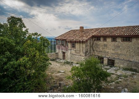 Old stone houses of the medieval town Chufut-Kale in the mountains. Bakhchisarai, Crimea.