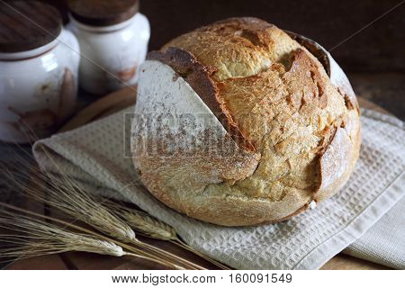 French country bread dark wooden chopping board rustic style