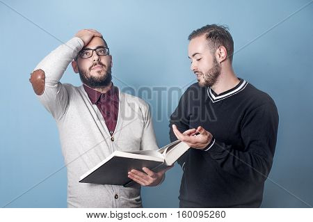 Two students are having hard time with learning. Hard subject. A student is trying to teach other student a lesson. Team work, student is helping to other student to prepare for test or exam.