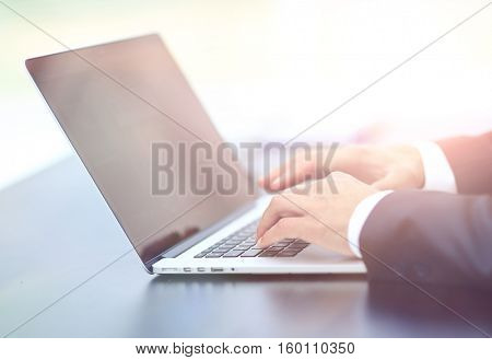 Person Typing on a modern laptop
