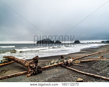 beachsmall islands and walkers in the beach off the Washington coast on the La Push Native American Reservation USA
