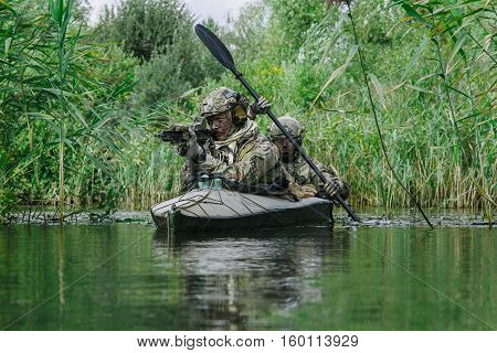 Special forces operators in the military kayak