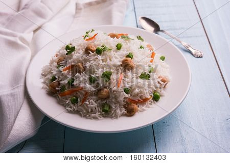 Yummy soya pulao or pilav or pulav or rice or soyabean chunk fried rice with peas and beans, indian or pakistani cuisine