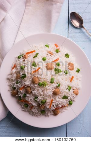 Yummy soya pulao or pilav or pulav or rice or soyabean chunk fried rice with peas and beans, indian or pakistani cuisine