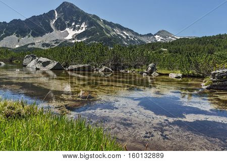Reflection of Sivrya peak and Banski lakes, Pirin Mountain, Bulgaria