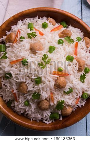Yummy soya pulao or pilav or pulav or rice or soyabean chunk fried rice with peas and beans, indian or pakistani cuisine