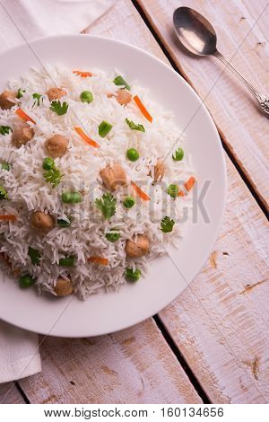 Yummy soya pulao or pilav or pulav or rice or soyabean chunk fried rice with peas and beans, indian or pakistani cuisine
