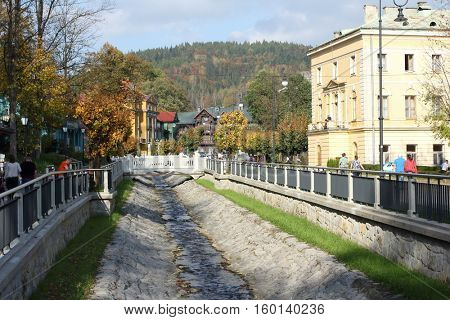 KRYNICA ZDROJ, POLAND - OCTOBER 13, 2016. River in Historic city center of Krynica Zdroj.