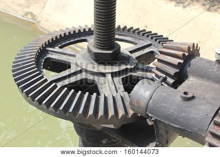 mechanical gear with a large toothed wheel of Floodgate valve