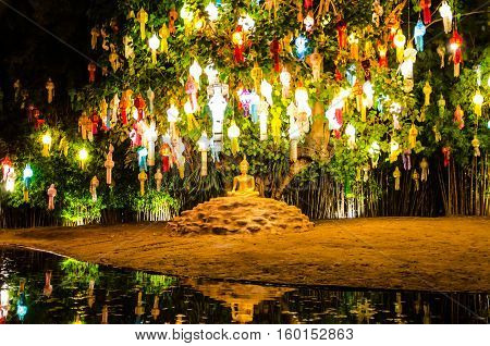 Buddhist monks sit meditating under a Bodhi Tree at the Wat Pan Tao temple November, 2015 in Chiang mai, Thailand