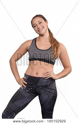 Portrait of beautiful and athlete young woman. Isolated white background.