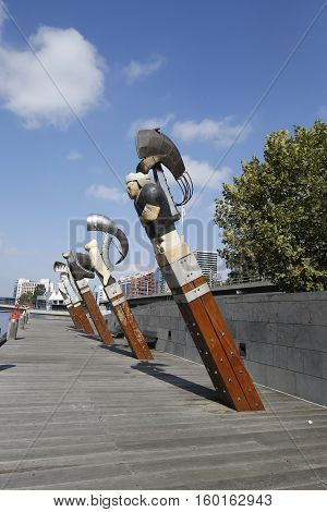 MELBOURNE, AUSTRALIA - JANUARY 25, 2016: Constellation sculptures by Bruce Armstrong and Geoffrey Bartlet in Melbourne. The five carved-wood figureheads comprise a dragon, woman, bird, man and lion.